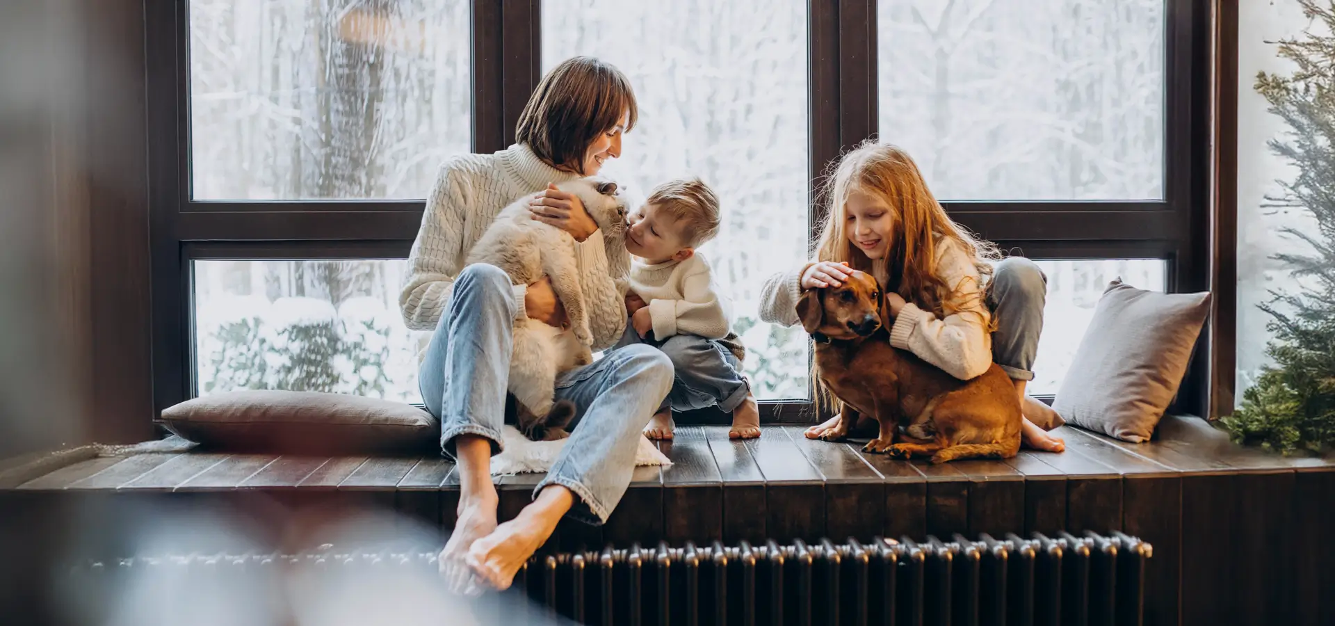 Family sitting in front of modern windows