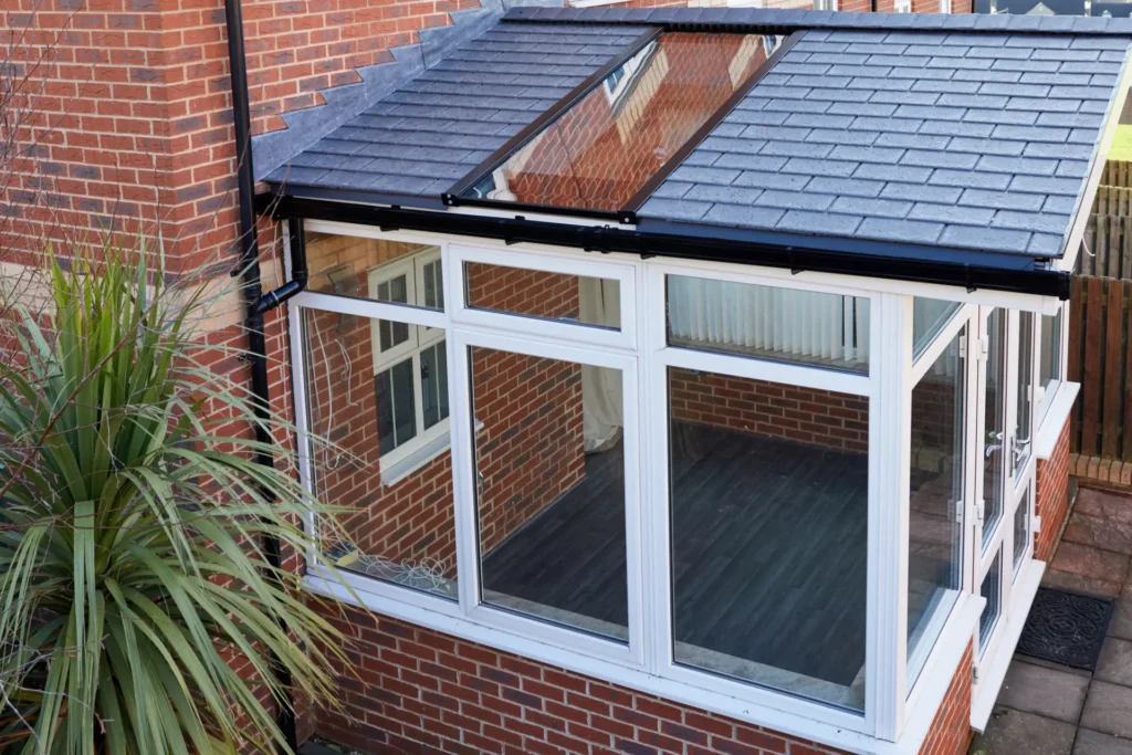 Conservatory with warm roof and large skylight window