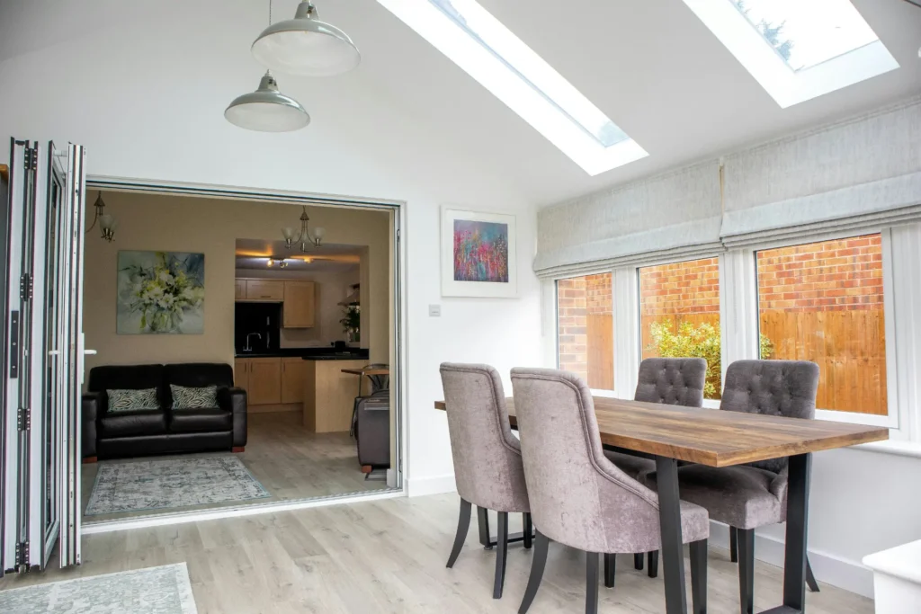 Extension providing an extra dining area for family use with skylights